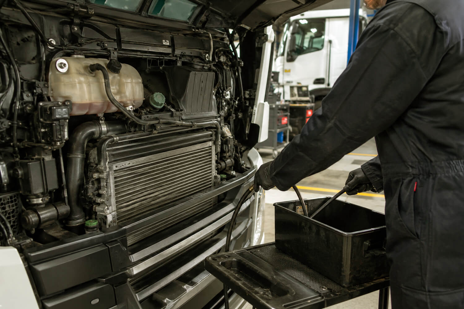 an engineer working on a HGV cooling system.
