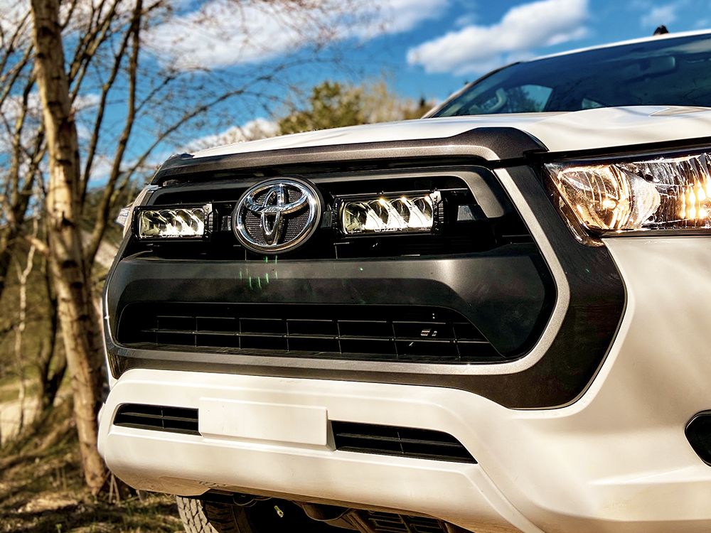 LAZER LAMPS Toyota Hilux (2021-Present) (Active, Icon and Invincible Models) - Grille Mount Kit (includes: 2x Triple-R 750 Wide, 1x Grille Mount Brackets, 1x 2L-LP-120)
